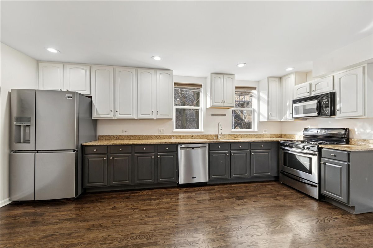 648 North Bishop Street, Unit S Chicago, IL 60642 - Photo 6 of 23 a kitchen with stainless steel appliances granite countertop a refrigerator sink and stove