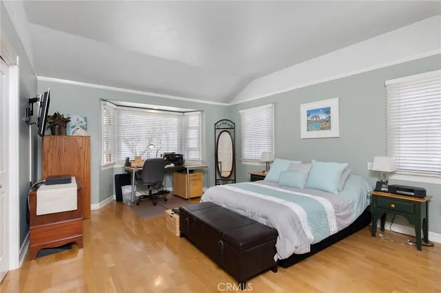 a bed room with a bed and a chair