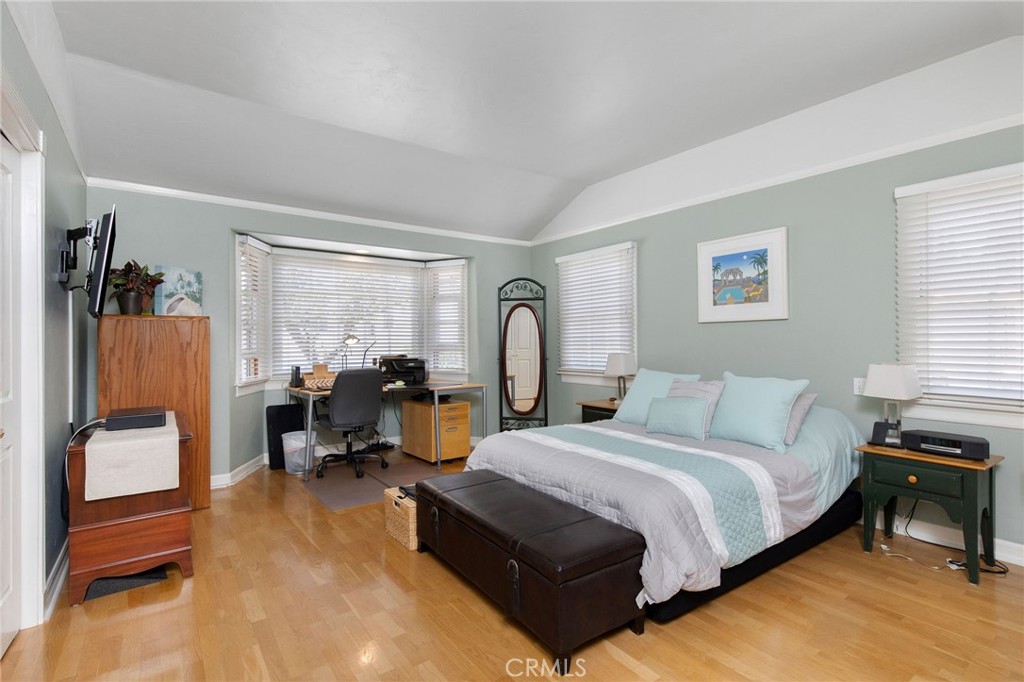 4124 East 5th Street Long Beach, CA 90814 - Photo 18 of 38 a bed room with a bed and a chair