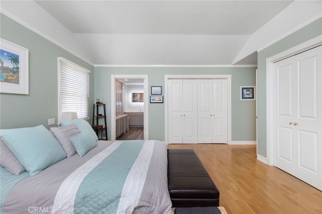 4124 East 5th Street Long Beach, CA 90814 - Photo 20 of 38 a bedroom with a bed and wooden floor