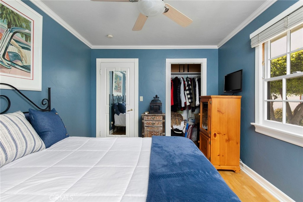 4124 East 5th Street Long Beach, CA 90814 - Photo 25 of 38 a bedroom with bed and wooden floor