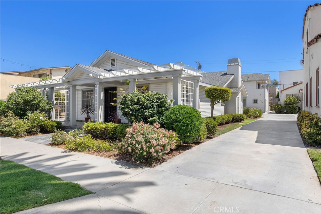 4124 East 5th Street Long Beach, CA 90814 - Photo 3 of 38 a front view of a house with a yard