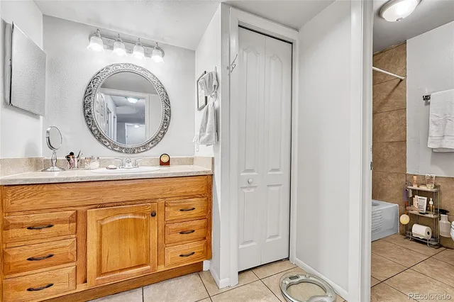 a bathroom with a sink a vanity and a mirror