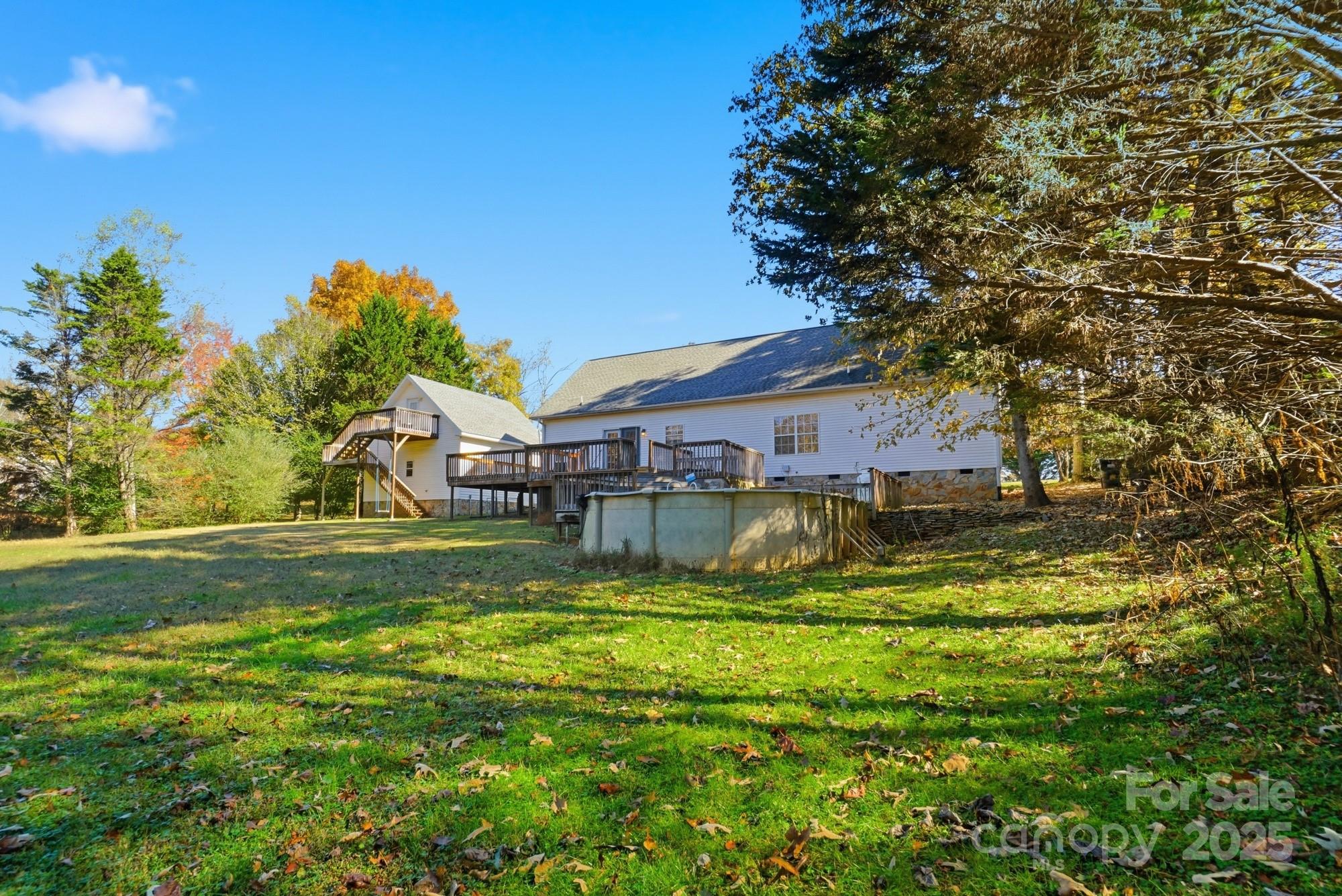 218 Fulbright Road Stony Point, NC 28678 - Photo 32 of 47 a view of a house with a big yard potted plants and large tree