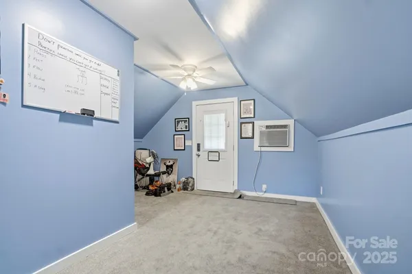 a view of a livingroom with furniture and a window