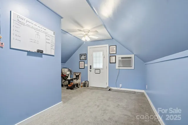 a view of a livingroom with furniture and a window