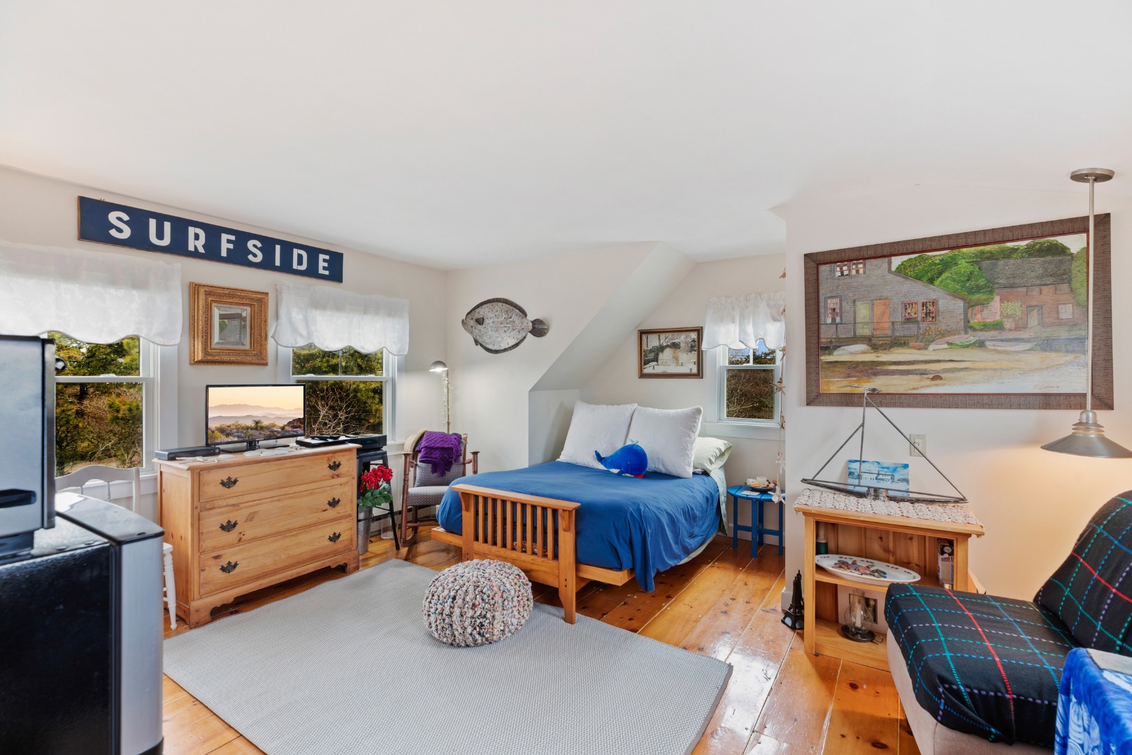 137 Surfside Road Nantucket, MA 02554 - Photo 18 of 24 a bedroom with furniture and a wooden floor
