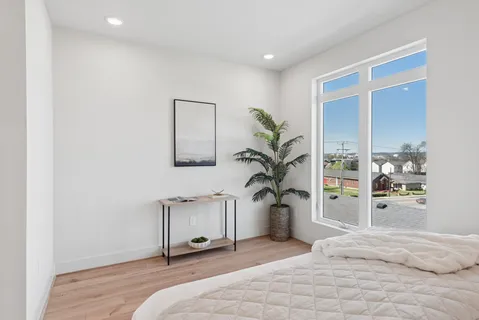 a view of a bedroom with kitchen