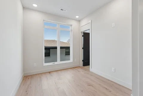 a bathroom with a sink toilet a mirror and vanity