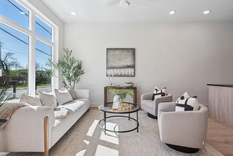a living room with furniture and white walls