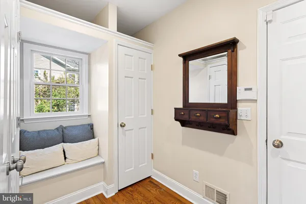 a bedroom with a large bed and a dresser