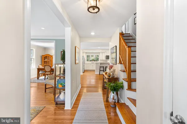 a hallway with a large mirror and workspace