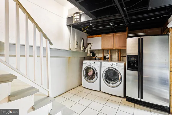 a view of living room with furniture and a window