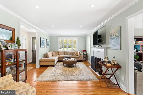 a living room with furniture fireplace and a flat screen tv