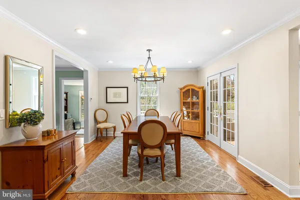 a view of a livingroom with furniture window and wooden floor