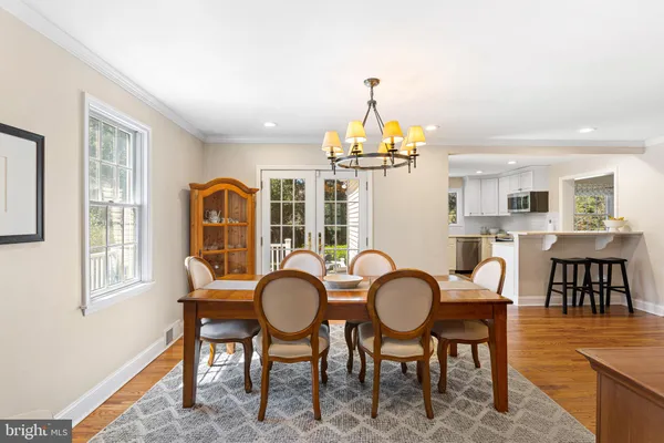 a view of a livingroom with furniture window and wooden floor