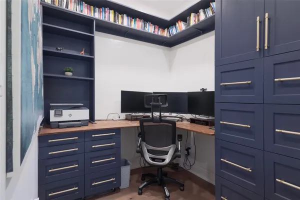 a view of a workspace with furniture