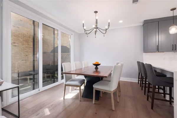 a view of a dining room with furniture window and wooden floor