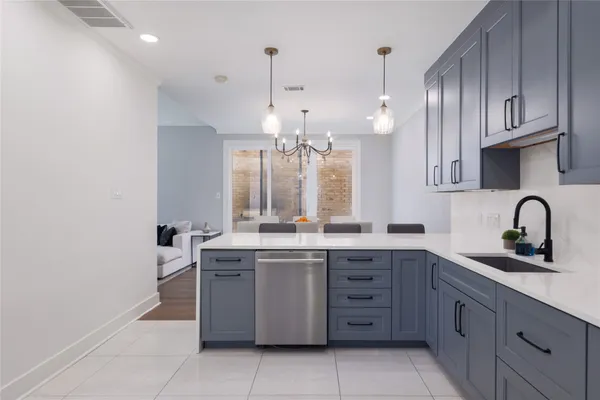 a kitchen with a sink and cabinets
