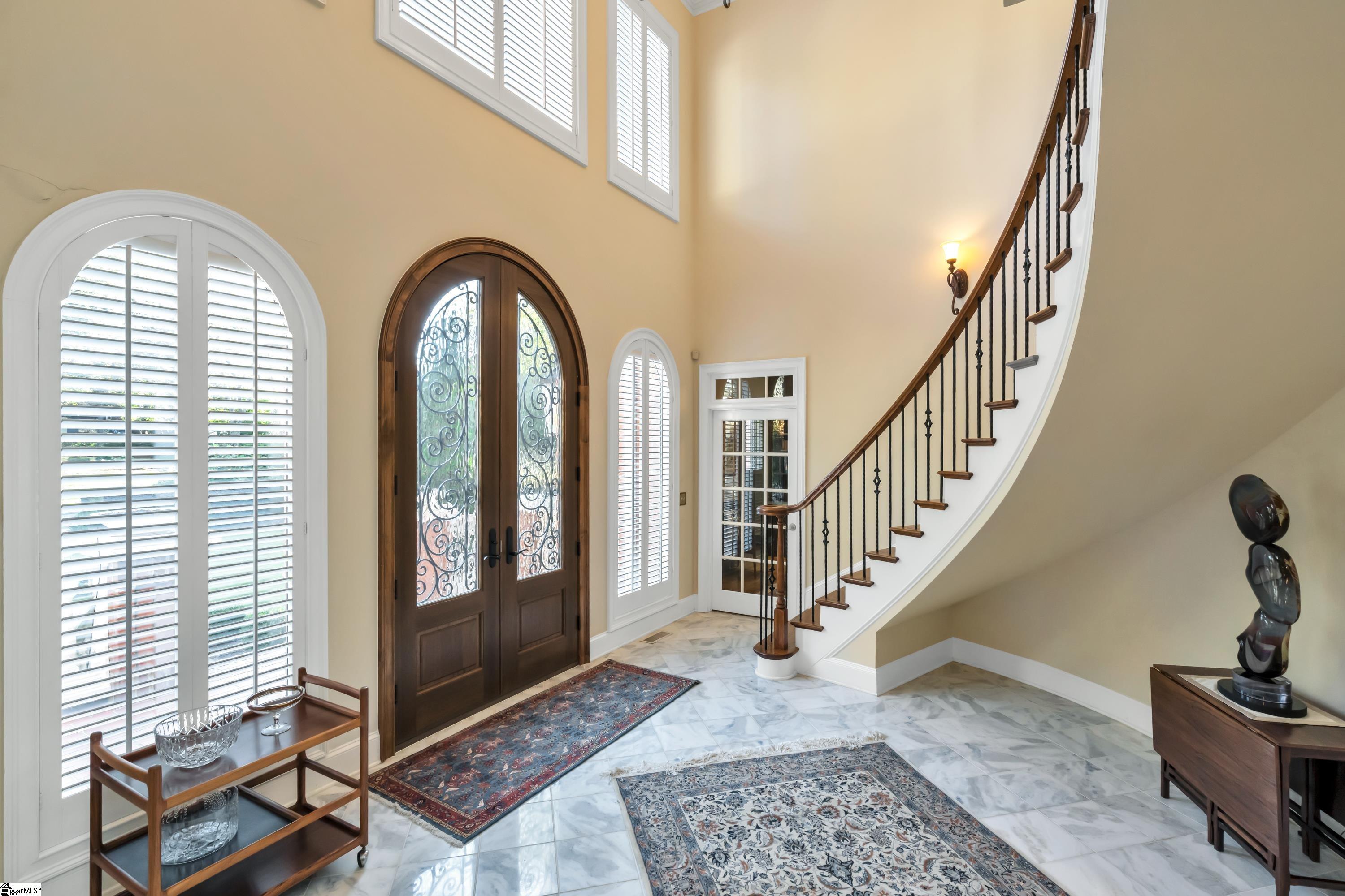 107 Tuscany Way Greer, SC 29650 - Photo 2 of 36 Custom door, circular staircase and marble floors