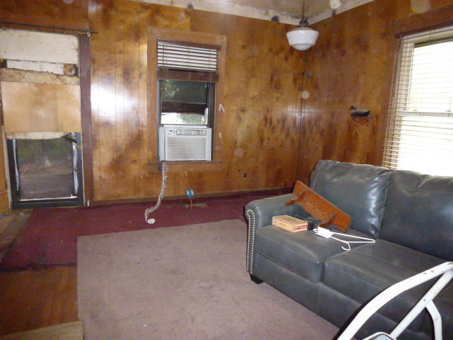 17221 Dewitt Road Dewitt, IL 61735 - Photo 7 of 9 a living room with furniture and a chandelier