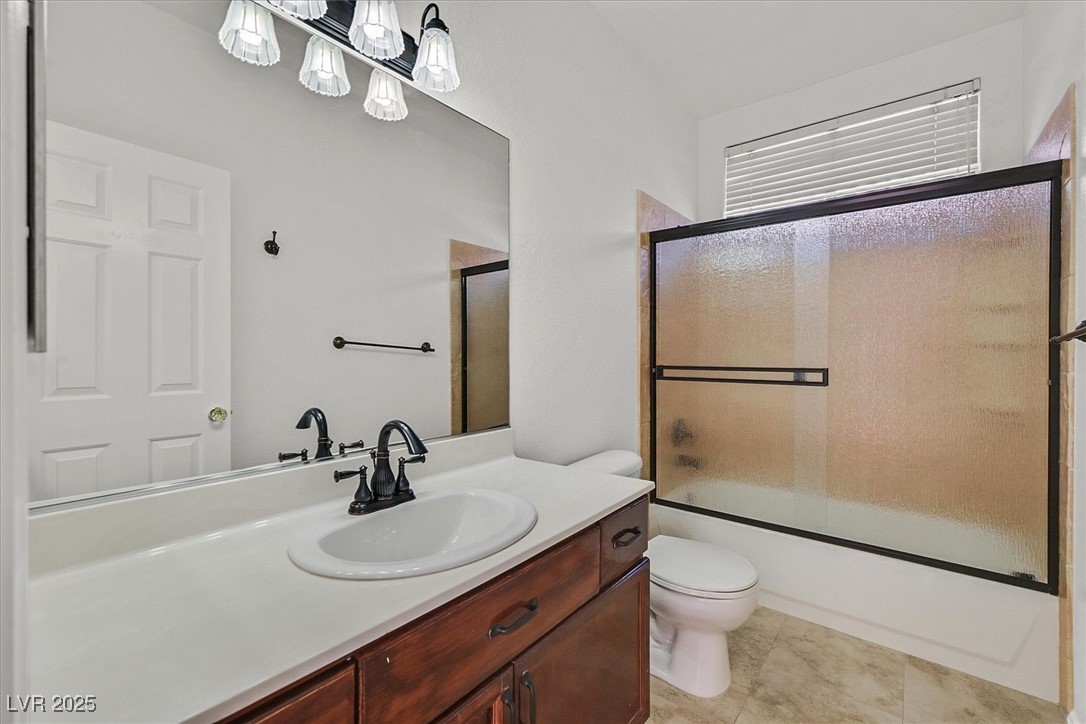 234 Highgate Street Henderson, NV 89074 - Photo 19 of 22 Full bath with vanity and enclosed tub / shower combo