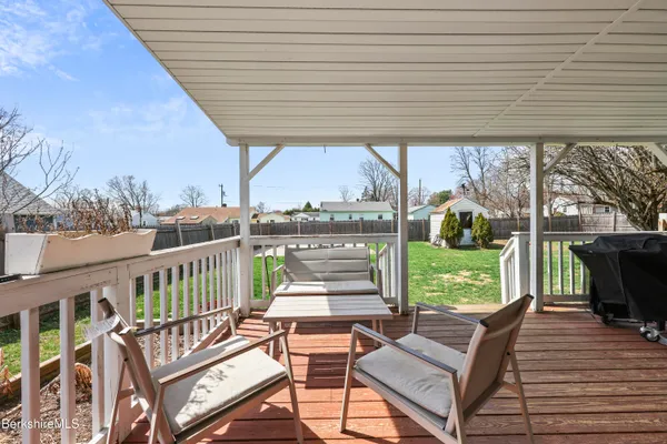 a view of a patio with a table and chairs