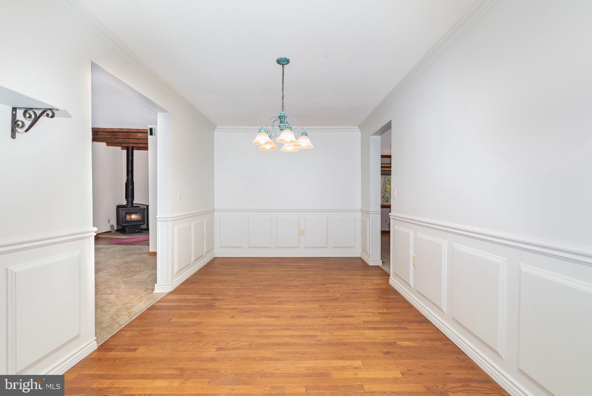 2091 Stumpstown Road Mechanicsburg, PA 17055 - Photo 11 of 52 a view of a room with wooden floor staircase and a hallway