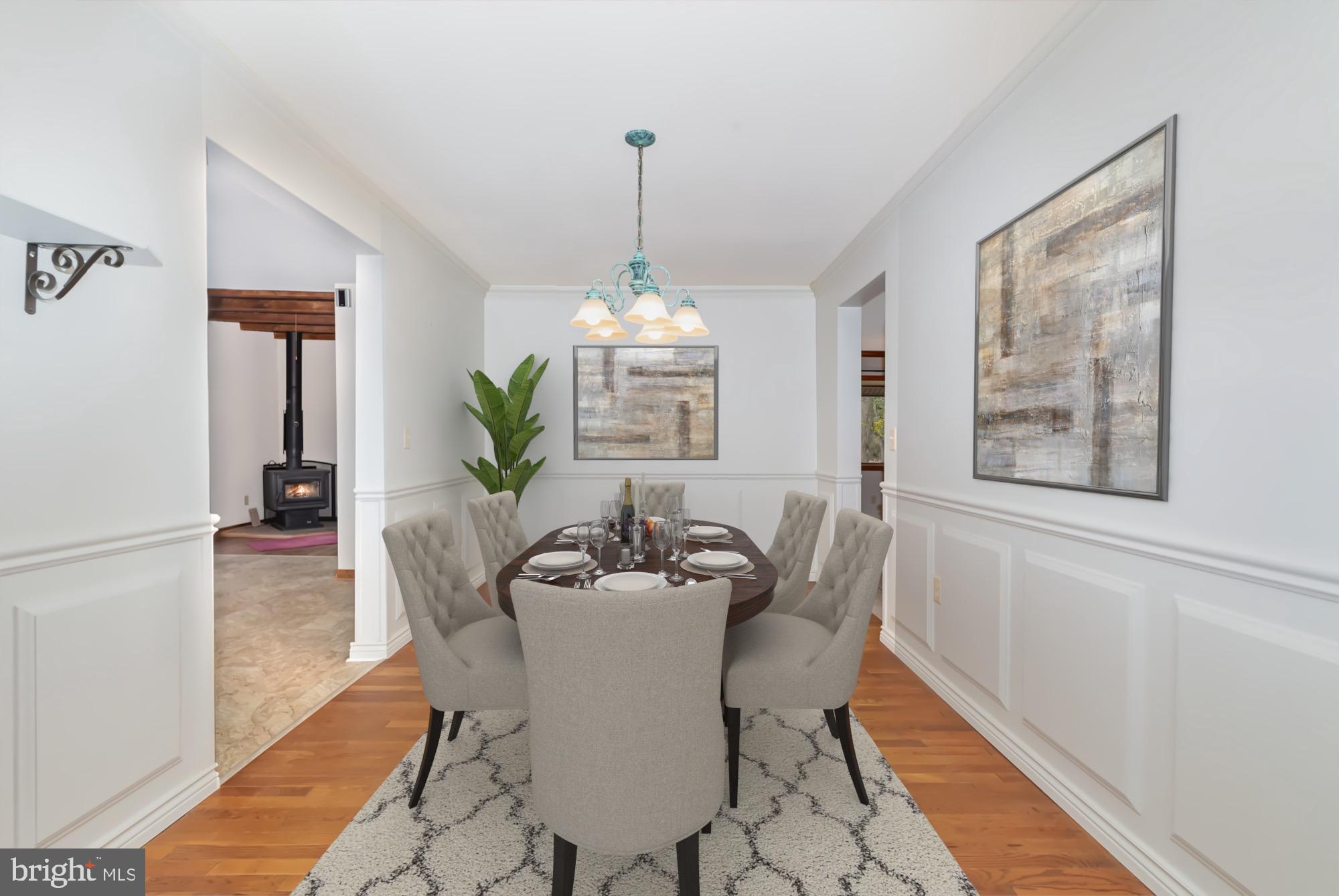 2091 Stumpstown Road Mechanicsburg, PA 17055 - Photo 12 of 52 a dining room with furniture potted plants and wooden floor