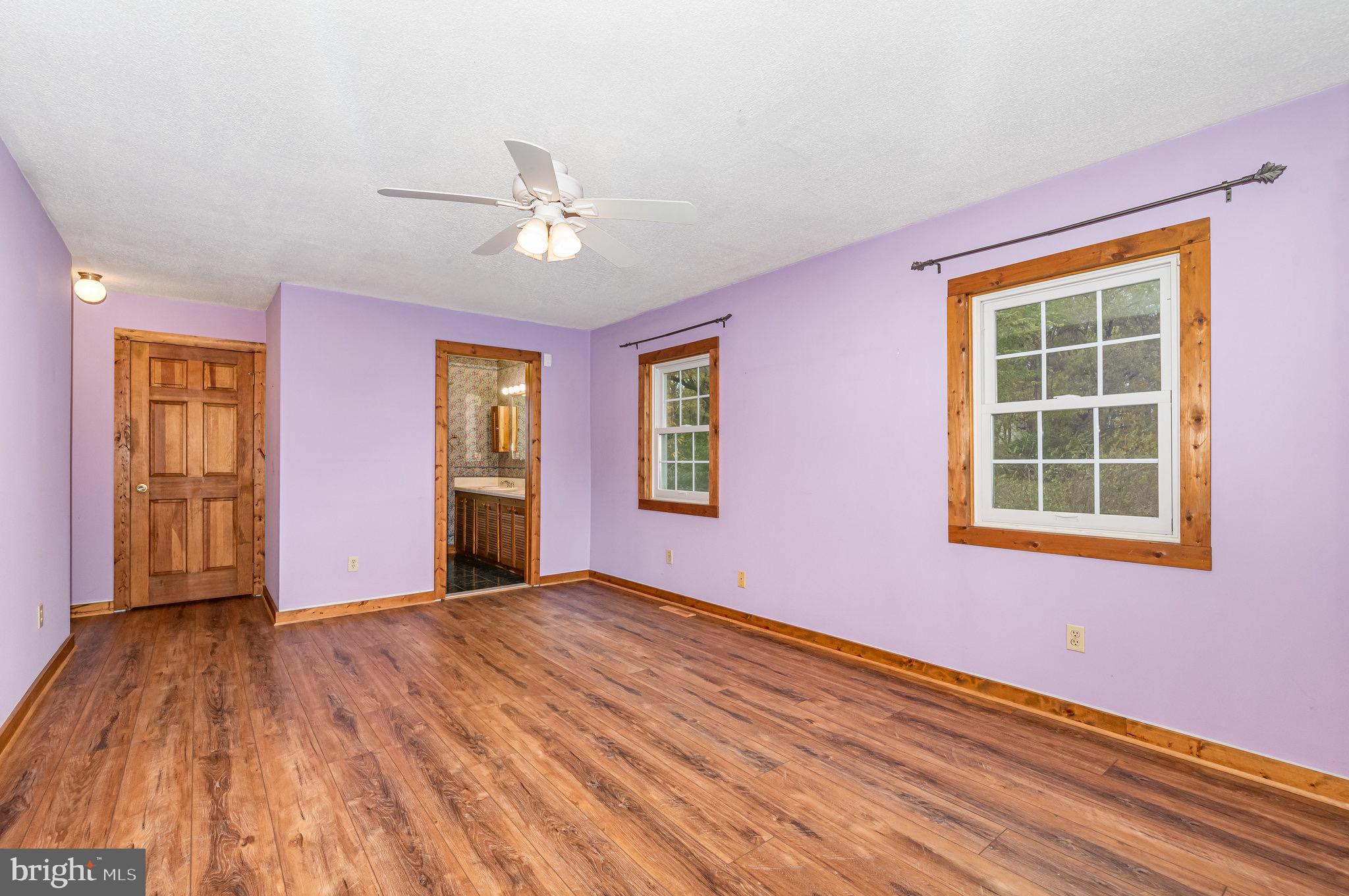 2091 Stumpstown Road Mechanicsburg, PA 17055 - Photo 23 of 52 a view of an empty room with a window and wooden floor