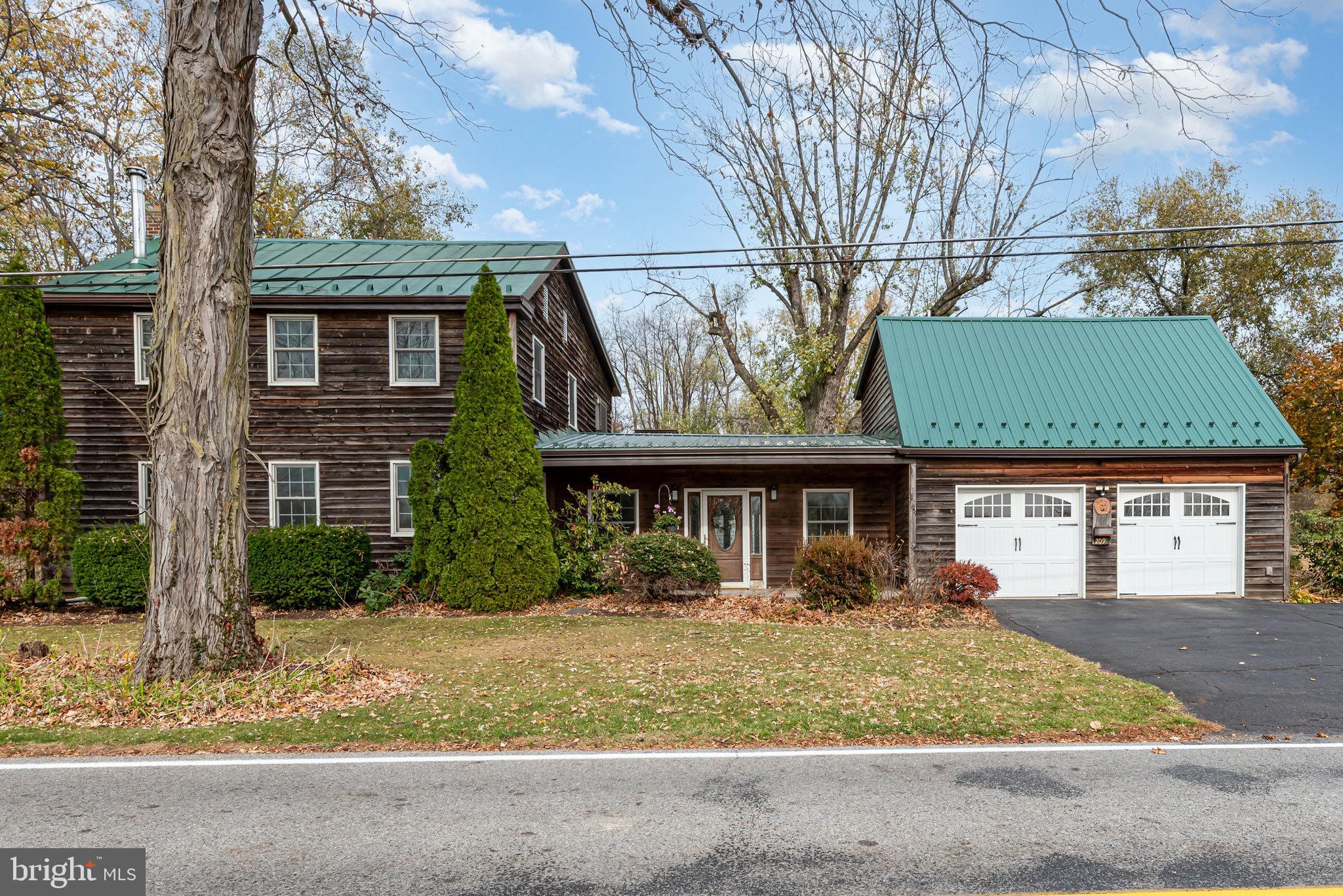 2091 Stumpstown Road Mechanicsburg, PA 17055 - Photo 36 of 52 a front view of a house with garden
