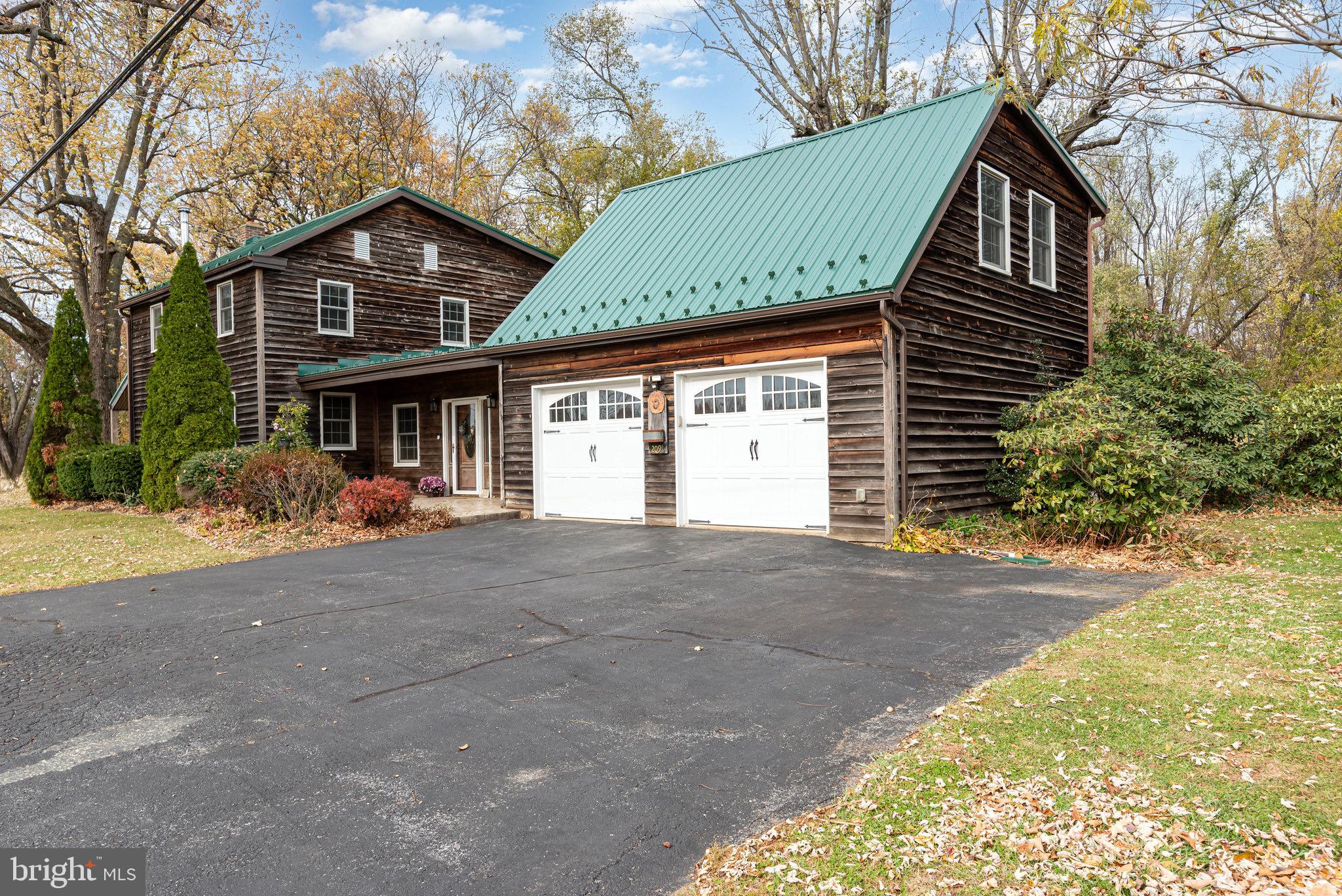 2091 Stumpstown Road Mechanicsburg, PA 17055 - Photo 37 of 52 a front view of a house with a yard and garage