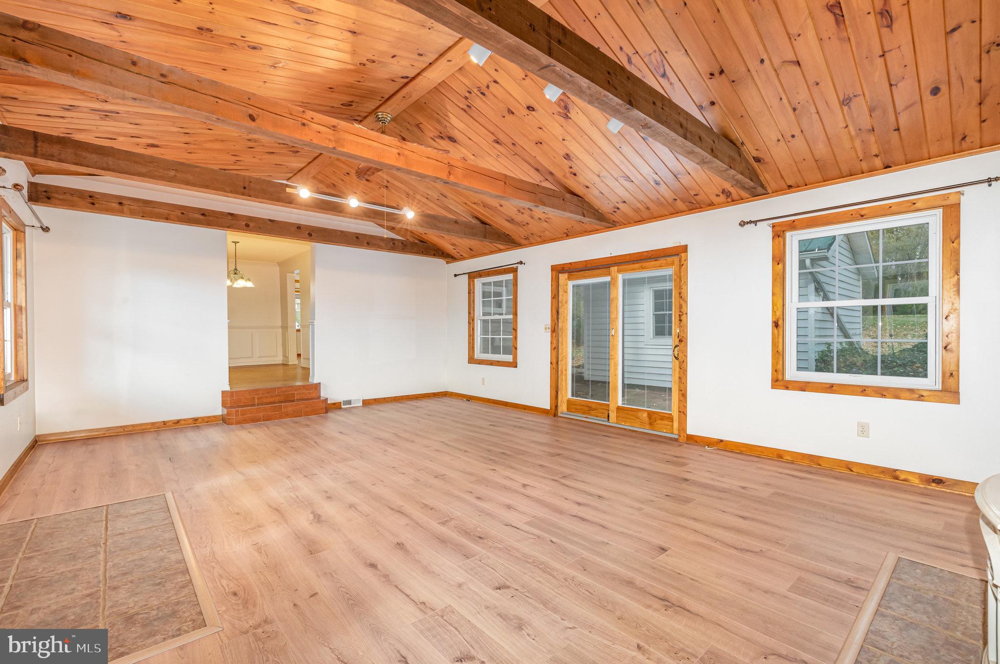 2091 Stumpstown Road Mechanicsburg, PA 17055 - Photo 7 of 52 a view of an empty room with windows