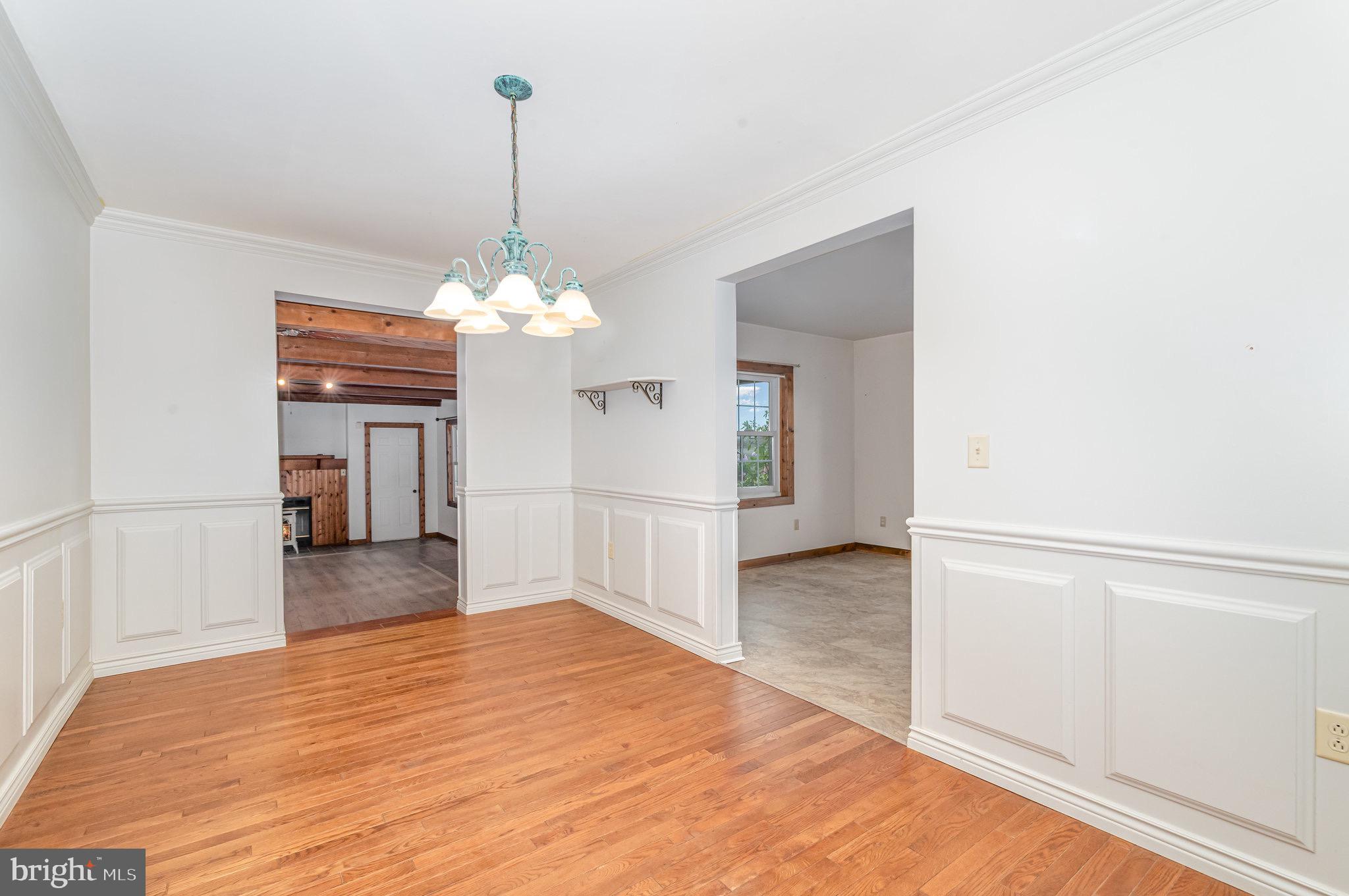 2091 Stumpstown Road Mechanicsburg, PA 17055 - Photo 10 of 52 a view of a livingroom with wooden floor and a large window
