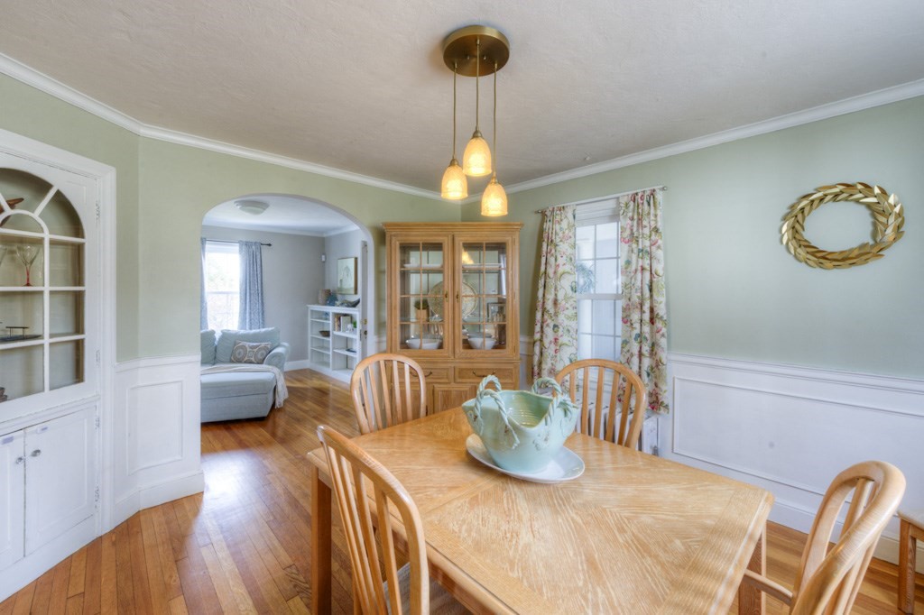 291 Beverly Road Worcester, MA 01605 - Photo 15 of 42 a view of a dining room with furniture a chandelier and wooden floor