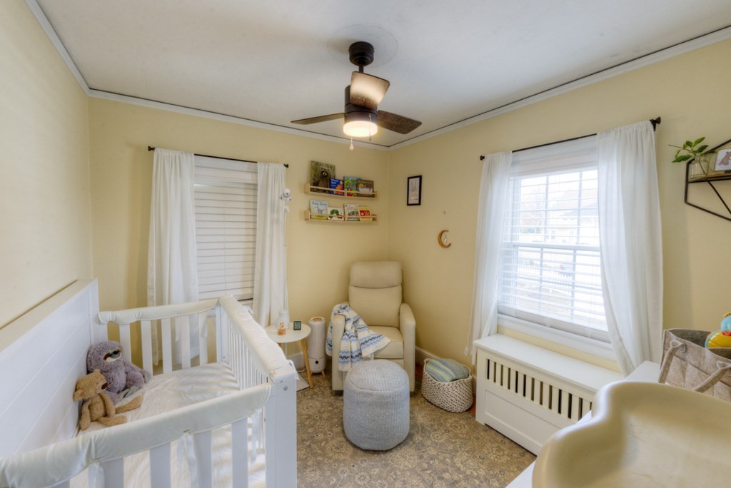 291 Beverly Road Worcester, MA 01605 - Photo 26 of 42 a bedroom with furniture and a large window