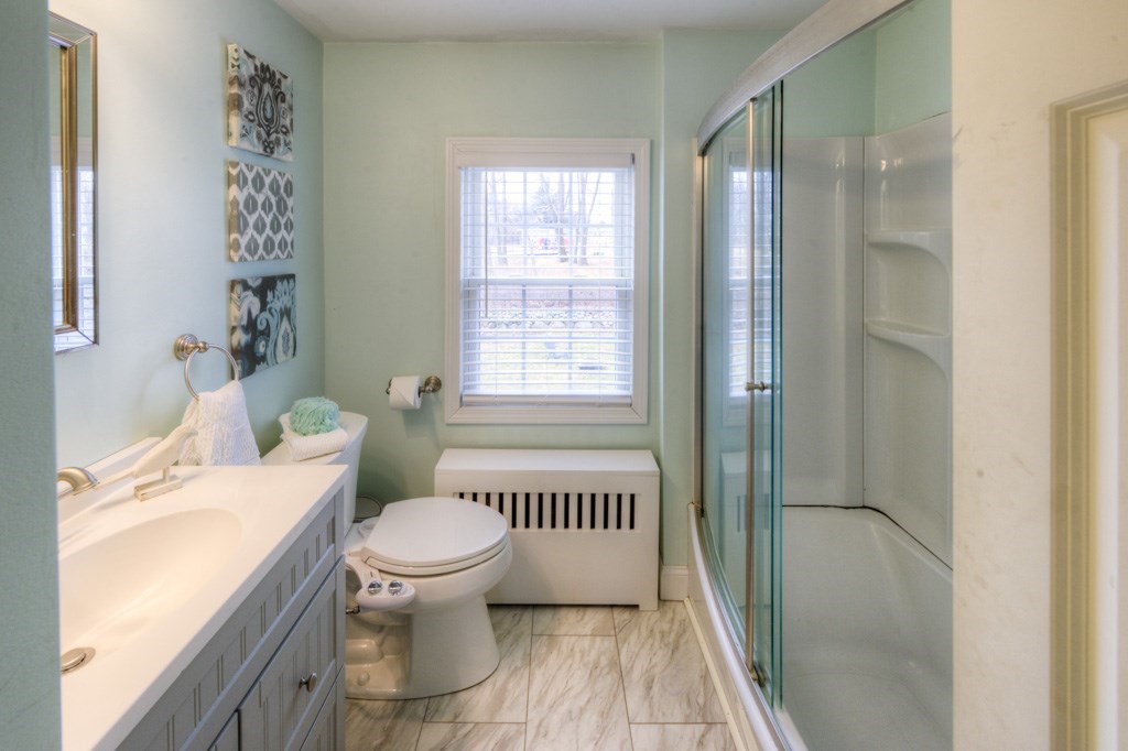 291 Beverly Road Worcester, MA 01605 - Photo 27 of 42 a bathroom with a bathtub shower sink and toilet