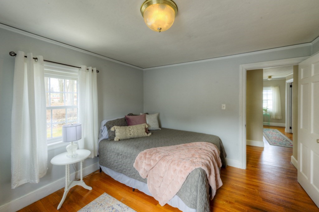 291 Beverly Road Worcester, MA 01605 - Photo 29 of 42 a bedroom with a bed and a lamp next to a window