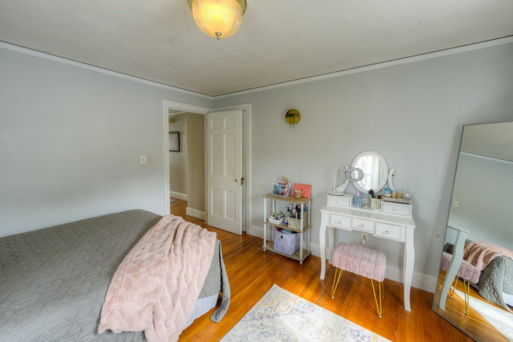 291 Beverly Road Worcester, MA 01605 - Photo 30 of 42 a bed room with a bed and a couch