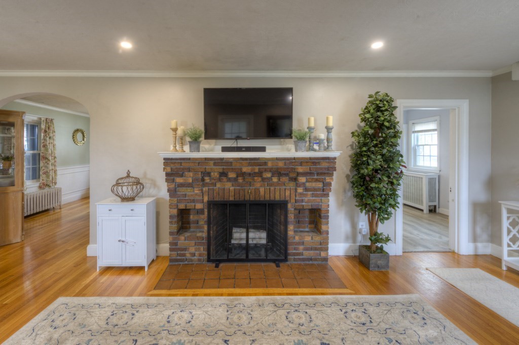 291 Beverly Road Worcester, MA 01605 - Photo 7 of 42 a living room with furniture and a fireplace