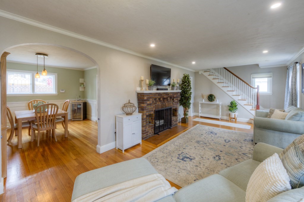 291 Beverly Road Worcester, MA 01605 - Photo 10 of 42 a living room with furniture and a fireplace
