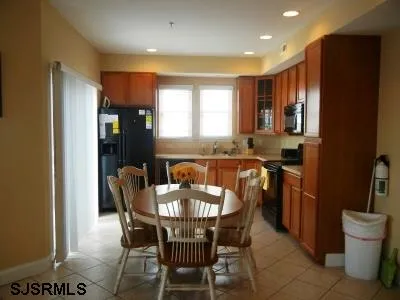 a view of a dining room with furniture and window