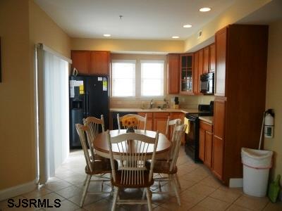 1301 West Avenue, Unit B Ocean City, NJ 08226 - Photo 3 of 11 a view of a dining room with furniture and window
