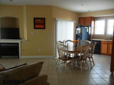 1301 West Avenue, Unit B Ocean City, NJ 08226 - Photo 5 of 11 a view of a dining room with furniture and window