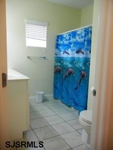 1301 West Avenue, Unit B Ocean City, NJ 08226 - Photo 9 of 11 a bathroom with a toilet and a shower