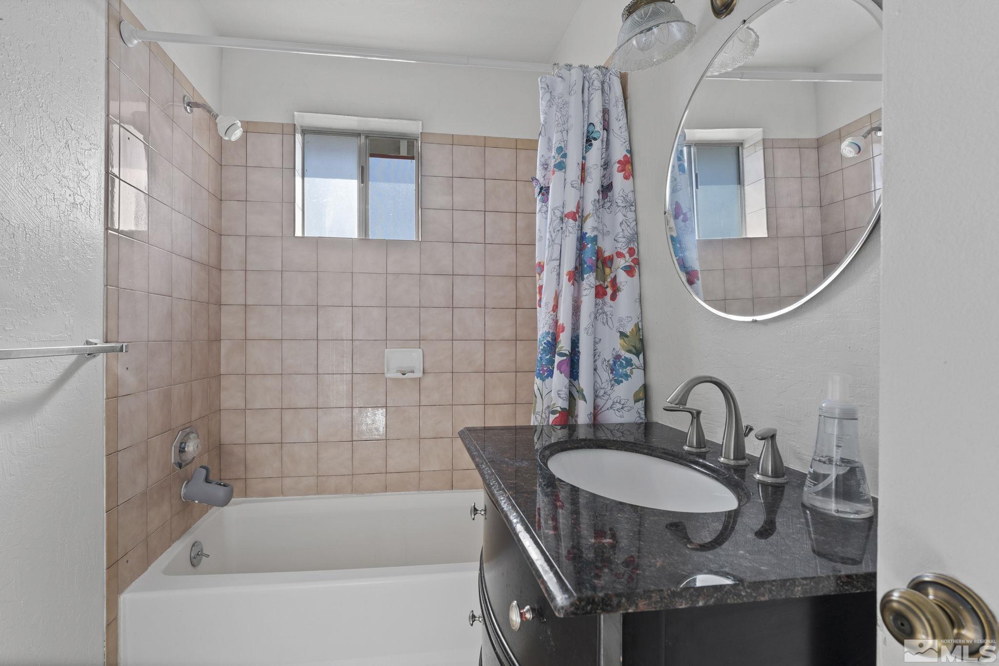 2375 Rice Road Fallon, NV 89406 - Photo 23 of 39 a bathroom with a sink and a mirror