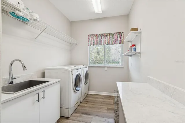 an aerial view of a house with a lake view