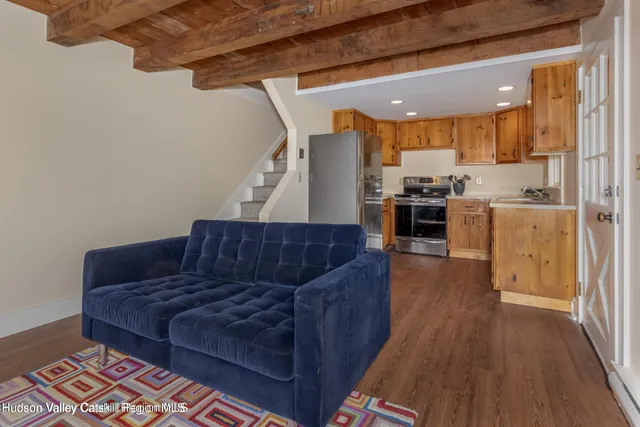 a kitchen with stainless steel appliances granite countertop a sink a stove and cabinets