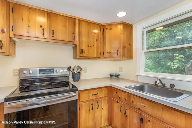 a kitchen with a sink and a stove top oven