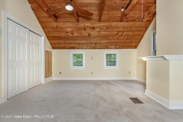 a spacious bathroom with a toilet sink and mirror